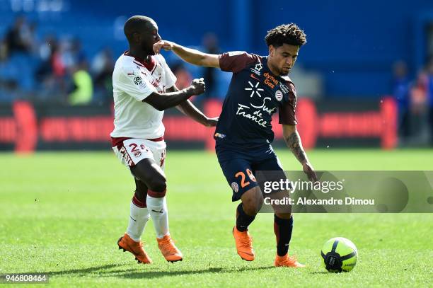 Youssouf Sabaly of Bordeaux and Keagan Dolly of Montpellier during the Ligue 1 match between Montpellier and Bordeaux at Stade de la Mosson on April...