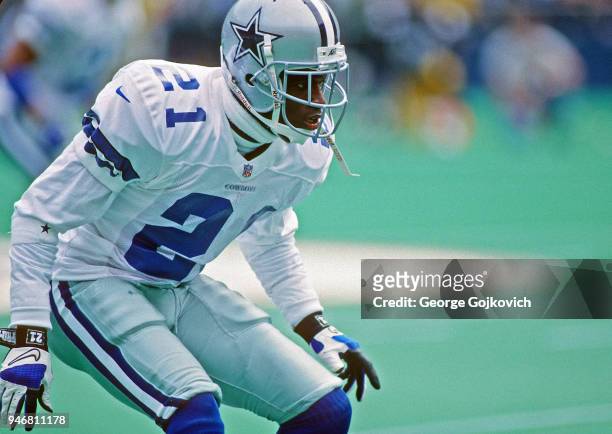 Cornerback Deion Sanders of the Dallas Cowboys looks on from the field during a game against the Pittsburgh Steelers at Three Rivers Stadium on...