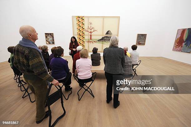 Guide leads a group of visitors through the Brandhorst museum in Munich December 15, 2009. The Brandhorst Museum was opened on May 21, 2009 and...