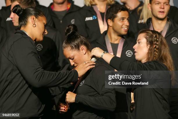 Dame Valerie Adams, silver medal for shot put checks the medals of Sophie Pascoe, gold medals for swimming helped by Julia Ratcliffe, gold medal for...