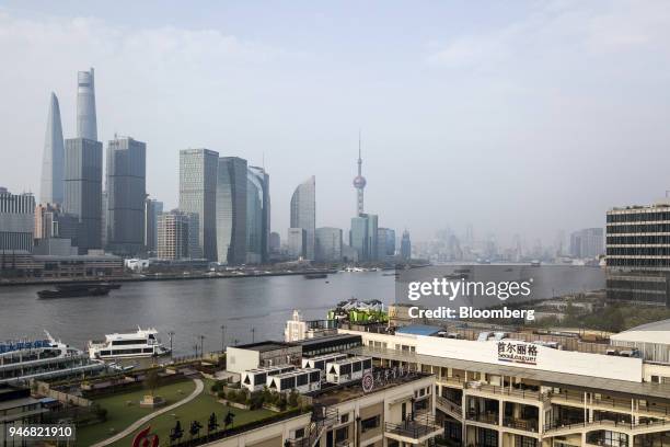 The Oriental Pearl Tower, center, stands among other buildings in the Lujiazui Financial District along the Pudong riverside in this aerial...