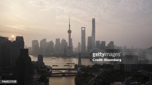 The Oriental Pearl Tower, center left, Shanghai World Financial Center, center, and the Shanghai Tower, center right, stand among other buildings in...
