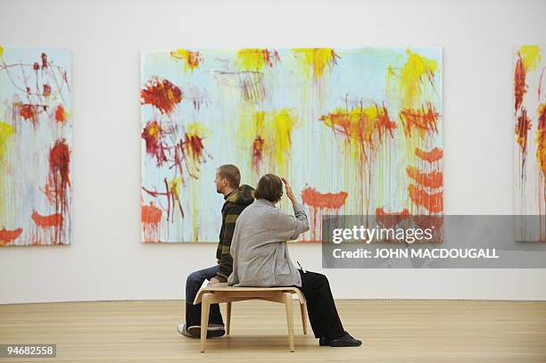 Visitors sit in front of US artist Cy Twombly's "Lepanto" series at the Brandhorst museum in Munich December 15, 2009. The Brandhorst Museum was...