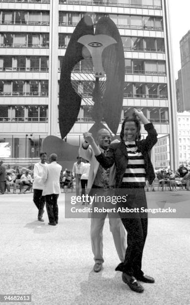 With Pablo Picasso's sculpture in the background, Chicagoans dance away the warm summer days in downtown's Daley Plaza, Chicago, IL, 2001.