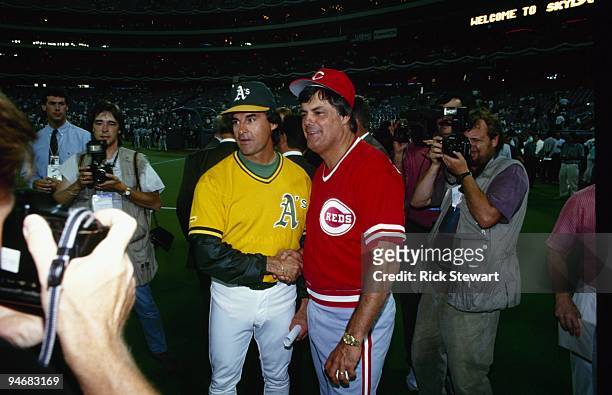 Managers Tony LaRussa of the Oakland Athletics and Lou Pinella of the Cincinnati Reds pose for a photo together during batting practice prior to...