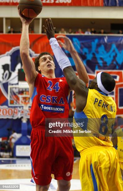 Sasha Kaun, #24 of CSKA Moscow competes with Doron Perkins, #8 of Maccabi Electra Tel Aviv during the Euroleague Basketball Regular Season 2009-2010...