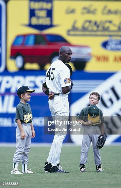 Michael Jordan of the Birmingham Barons stands for the National Anthem before an August 1994 game against the Memphis Chicks at Hoover Metropolitan...