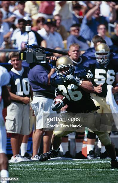 Tom Lopienski of the Notre Dame Fighting Irish carries the ball during the game against the Texas A&M Aggies at Notre Dame Stadium on September 2,...