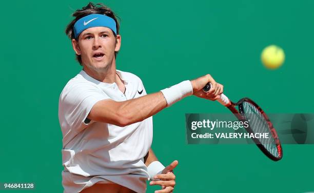 Jared Donaldson returns the ball to Spain's Albert Ramos-Vinolas during their round of 64 tennis match at the Monte-Carlo ATP Masters Series...