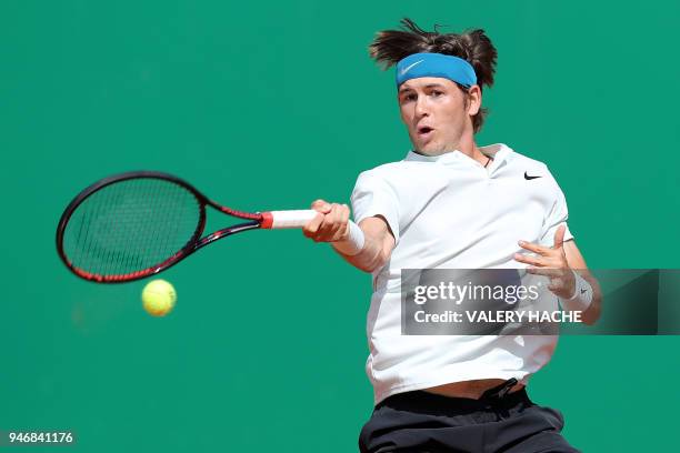 Jared Donaldson returns the ball to Spain's Albert Ramos-Vinolas during their round of 64 tennis match at the Monte-Carlo ATP Masters Series...