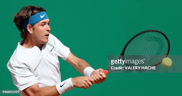 Jared Donaldson returns the ball to Spain's Albert Ramos-Vinolas during their round of 64 tennis match at the Monte-Carlo ATP Masters Series...