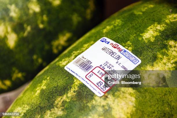 Price and weight information sticker is displayed on a watermelon inside a Pick n Pay Stores Ltd. Supermarket in Johannesburg, South Africa, on...