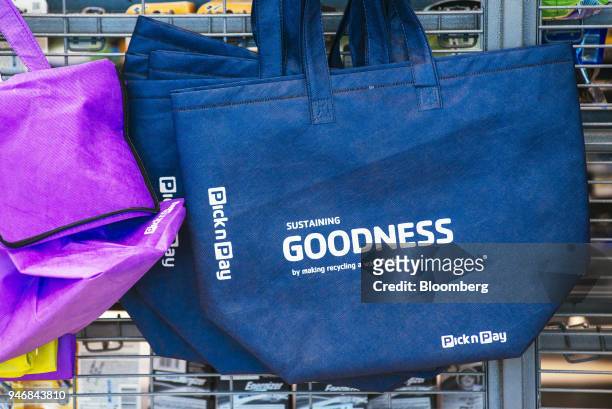 Branded reusable shopping tote bag hangs on display inside a Pick n Pay Stores Ltd. Supermarket in Johannesburg, South Africa, on Monday, April 9,...