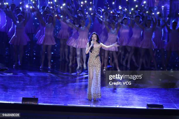 Singer Karen Mok performs on the stage during the opening ceremony of 2018 Beijing International Film Festival at Yanqi Lake International Convention...