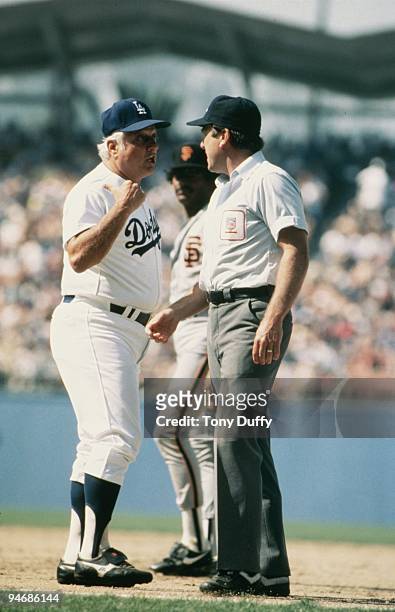 Manager Tommy Lasorda of the Los Angeles Dodgers argues with an umpire during a game against the San Francisco Giants at Dodger Stadium in Los...