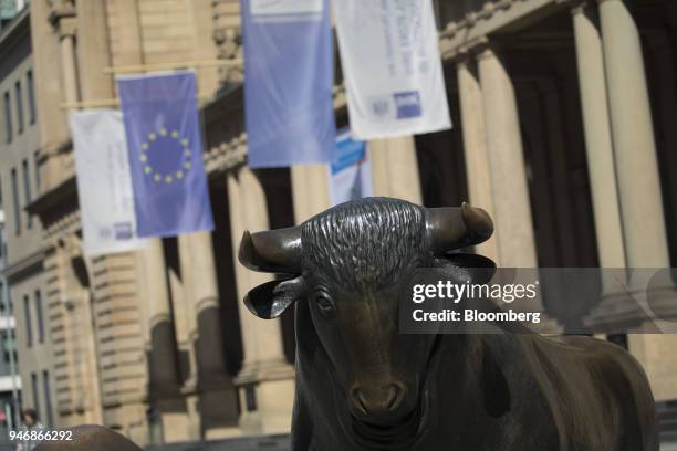 Bull statue stands outside the Frankfurt Stock Exchange, operated by Deutsche Boerse AG, in Frankfurt, Germany, in Frankfurt, Germany, on Monday,...
