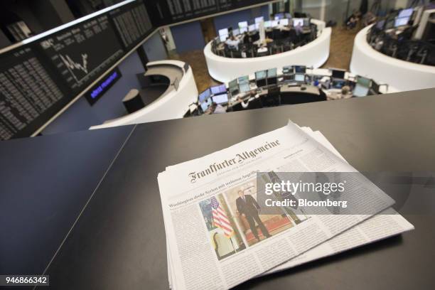 Copy of Frankfurter Allgemeine broadsheet newspaper features a photo of U.S. President Donald Trump, on a balcony overlooking the trading floor...