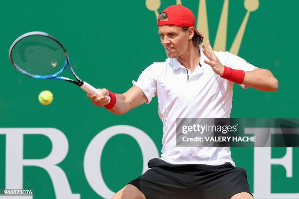 Czech Republic's Tomas Berdych returns a ball to Japan's Kei Nishikori during their round of 64 tennis match at the Monte-Carlo ATP Masters Series...