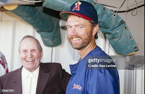 Owner of the California Angels Gene Autry and Bert Blyleven stand for a photograph prior to a game at Anaheim Stadium during the 1990 season in...