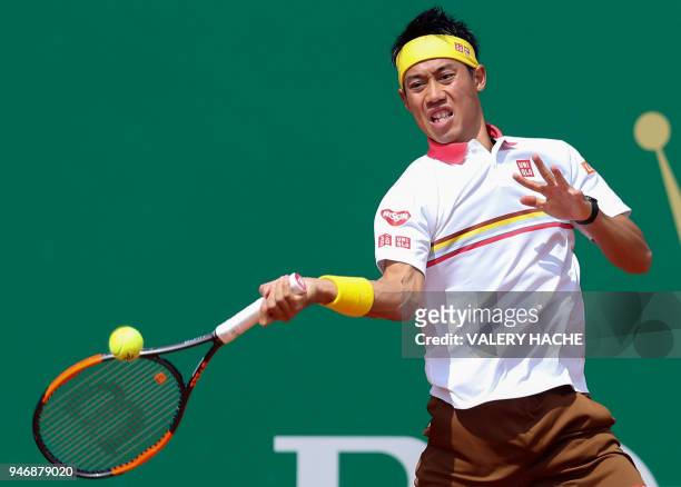 Japan's Kei Nishikori returns a ball to Czech Republic's Tomas Berdych during their round of 64 tennis match at the Monte-Carlo ATP Masters Series...