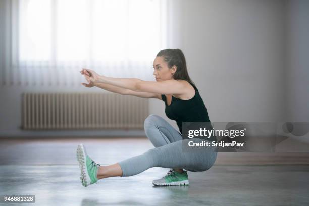 very hard squat - crouching stock pictures, royalty-free photos & images