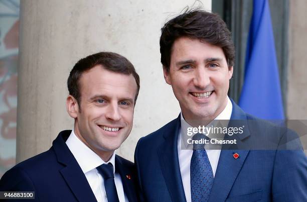 French president Emmanuel Macron welcomes Canadian Prime Minister Justin Trudeau prior their meeting at the Elysee Palace on April 16, 2018 in Paris,...