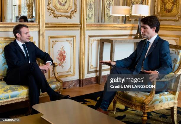 French President Emmanuel Macron and Canadian Prime Minister Justin Trudeau hold a meeting at the Elysee Palace in Paris, on April 16, 2018. Prime...