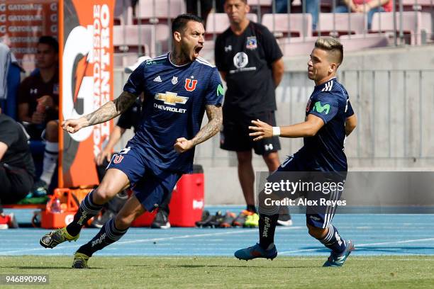 Mauricio Pinilla of U de Chile celebrates with teammate Yeferson Soteldo after scoring the first goal his team during a match between U de Chile and...