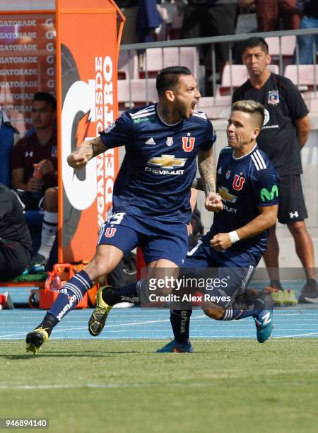 Mauricio Pinilla of U de Chile celebrates with teammates after scoring the first goal of his team during a match between U de Chile and Colo Colo as...