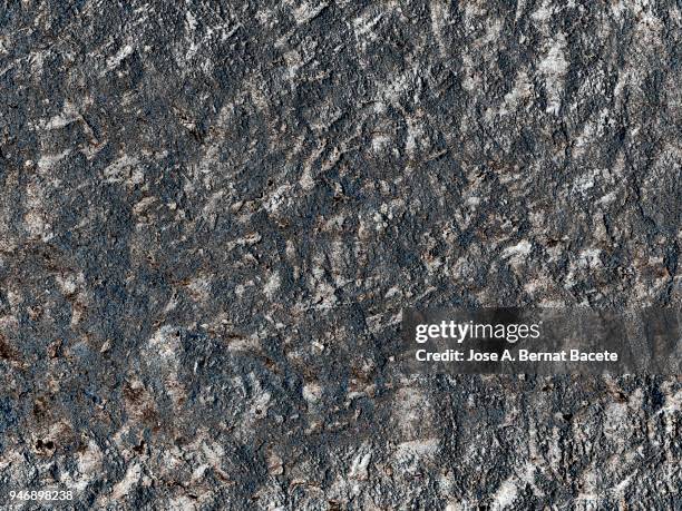 complete setting of a facade of a cement wall with stones ancient and spoil in the time. high resolution photography. - adobe texture stockfoto's en -beelden