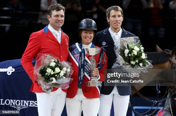 Second Devin Ryan riding 'Eddie Blue', winner Elizabeth Beezie Madden of USA riding 'Breitling LS', third Henrik von Eckermann of Sweden riding...