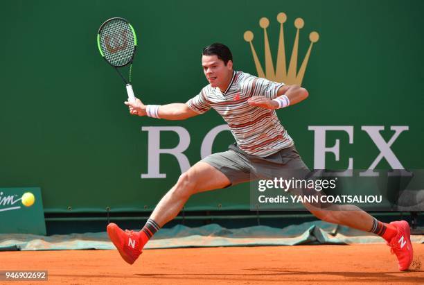Canada's Milos Raonic returns a ball to Monaco's Lucas Catarina during their round of 64 tennis match at the Monte-Carlo ATP Masters Series...