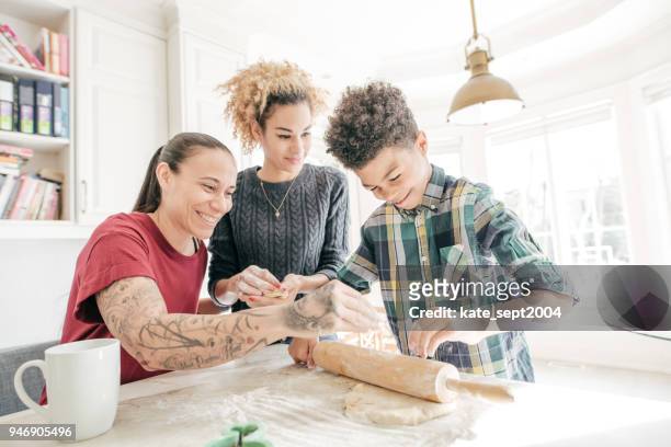 LGBTQ family baking cookies together