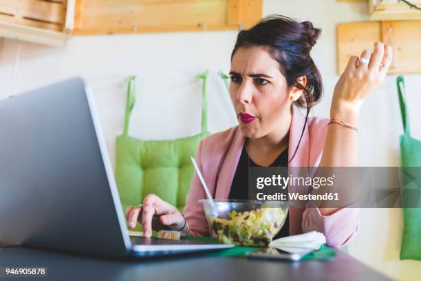 young businesswoman having healthy lunch and using laptop - angry typing stock pictures, royalty-free photos & images
