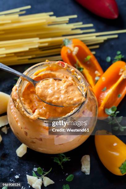 glass and spoon of pesto alla calabrese - poivron photos et images de collection