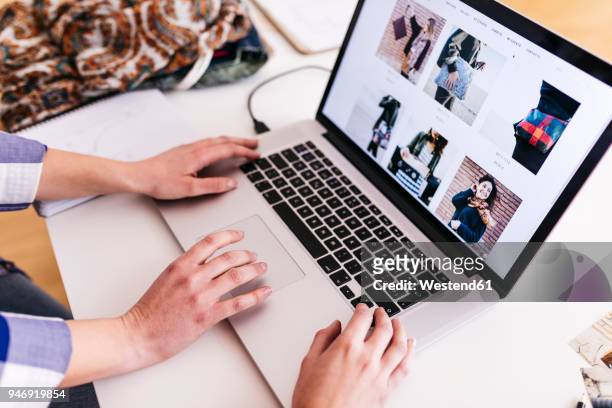 close-up of two women working on photos on laptop - fashion blogger stock pictures, royalty-free photos & images