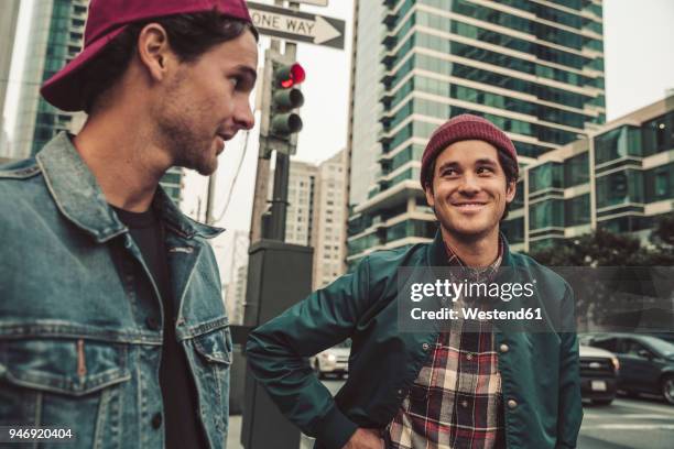 two young men in the city on the move - cool car photos stock pictures, royalty-free photos & images