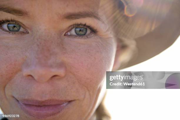 close-up portrait of smiling woman - mature woman face beauty stock-fotos und bilder