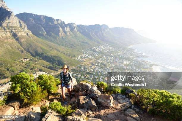 south africa, cape town, woman on hiking trip to lion's head - lion's head mountain stock pictures, royalty-free photos & images