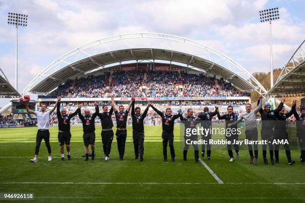 David Wagner head coach / manager of Huddersfield Town celebrates with his coaching staff at full time during the Premier League match between...