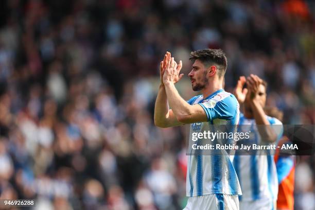 Christopher Schindler of Huddersfield Town applauds the fans at full time during the Premier League match between Huddersfield Town and Watford at...