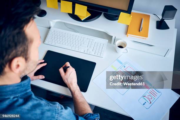 web designer developing responsive website layout - graphic design layout stock pictures, royalty-free photos & images