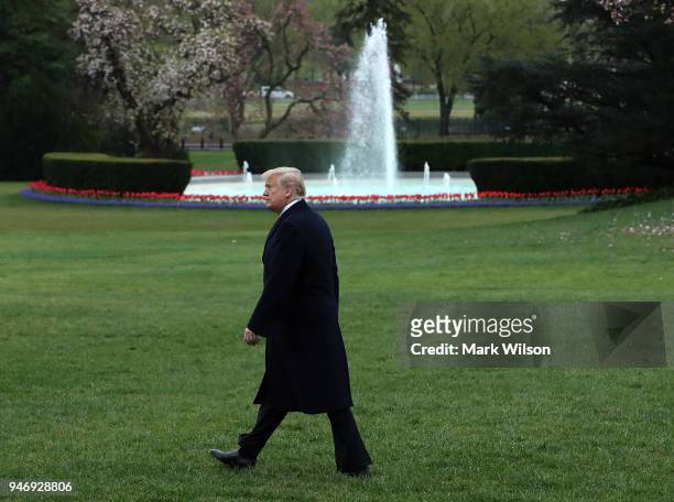 President Donald Trump walks toward Marine One while departing from the White House, on April 16, 2018 in Washington, DC. President Trump is...