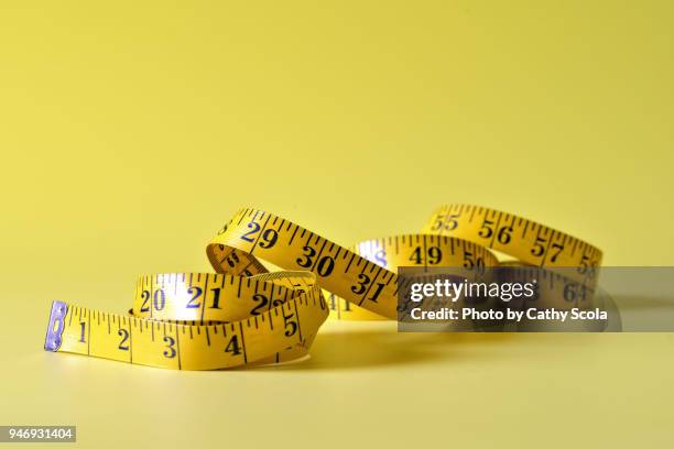 measuring tape - measuring tape stock-fotos und bilder