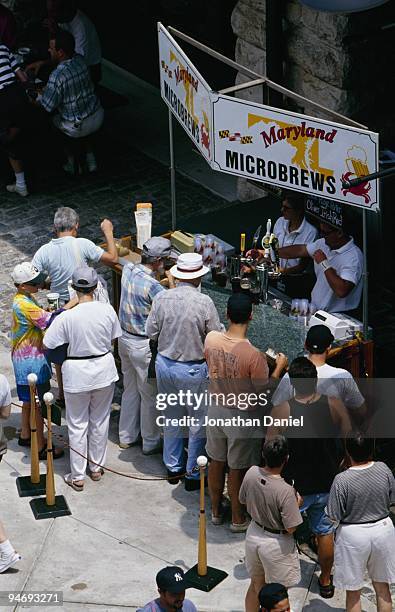 Fans stand in line to buy beer during a baseball game at Comiskey Park circa 1991 in Chicago, Illinois.