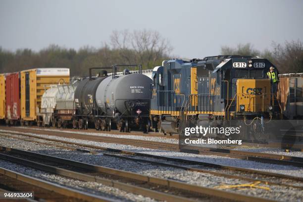 Transportation Inc. Freight train locomotives sit parked at a rail yard in Bowling Green, Kentucky, U.S., on Friday, April 13, 2018. CSX Corp. Is...