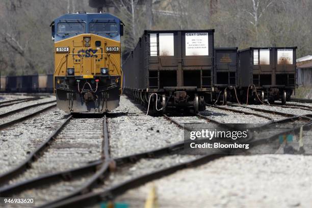 Transportation Inc. Freight locomotive sits parked next to empty coal trains at a rail yard in Danville, West Virginia, U.S., on Saturday, April 14,...