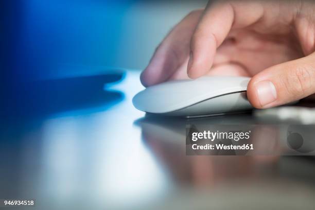 man's hand using computer mouse - mouse close up stock pictures, royalty-free photos & images