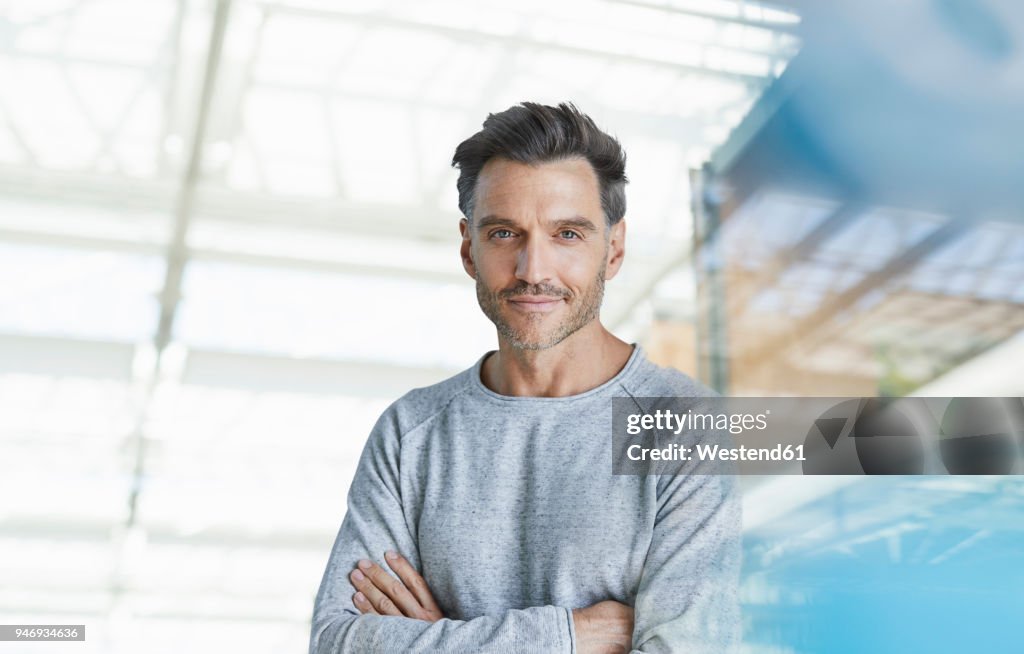 Portrait of smiling mature man with stubble