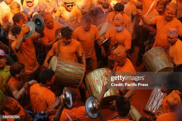 People play traditional musical instruments during the celebration of Sindoor Jatra Festival at Thimi in Bhaktapur. The festival is celebrated to...